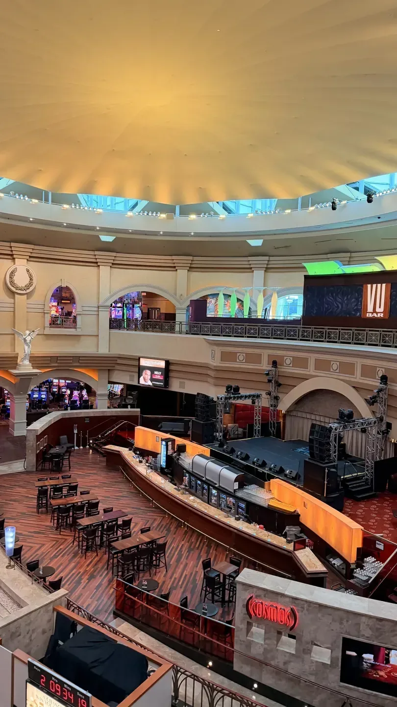 The grand interior lobby of a casino hotel in Windsor, with a long bar and tiered seating